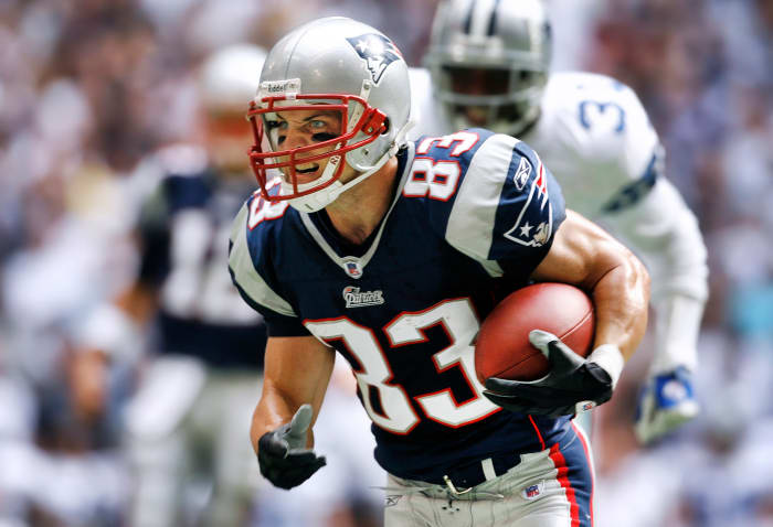 Patriots receiver Wes Welker runs after catching a pass against the Cowboys
